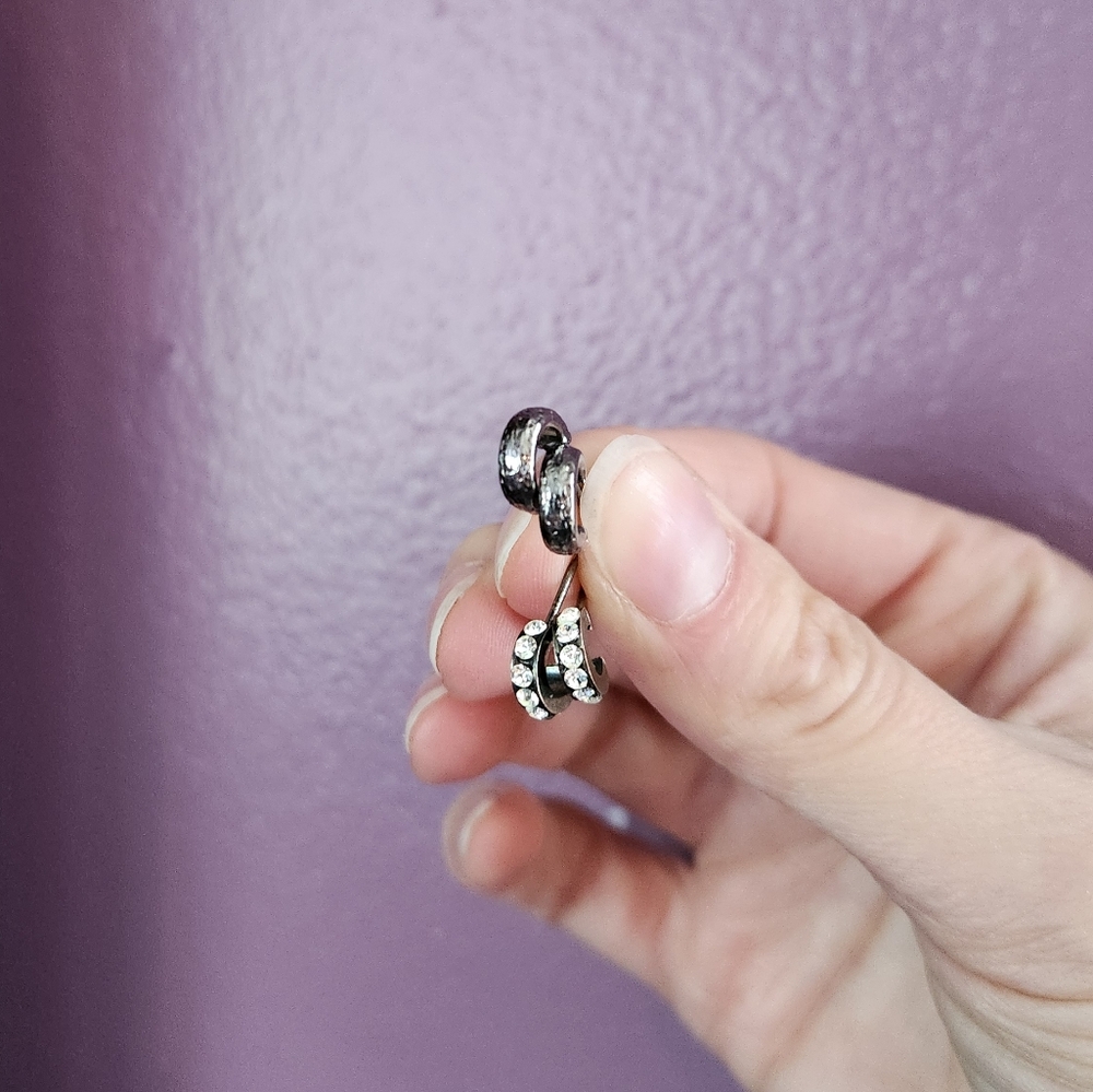 Set of tiny hoop post earrings in dark hammered metal and rhinestone pave